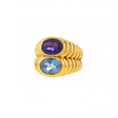 Sortija Bulgari Doppio en oro amarillo,  topacio azul y cordierita