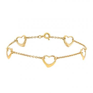 Tiffany 
Co Open Heart bracelet in yellow gold