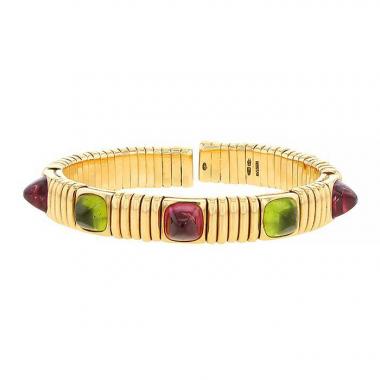 Bracelet époque années 70 Bulgari Tubogas en or jaune,  tourmalines roses et péridots