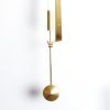 Pierre Forssell, set of ten "Pendulum" wall mounted candlesticks in polished brass, produced by Skultuna in the 1960s, signed - Detail D1 thumbnail
