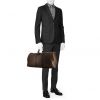 Louis Vuitton Keepall 55 cm travel bag in brown monogram canvas Macassar and black leather - Detail D1 thumbnail