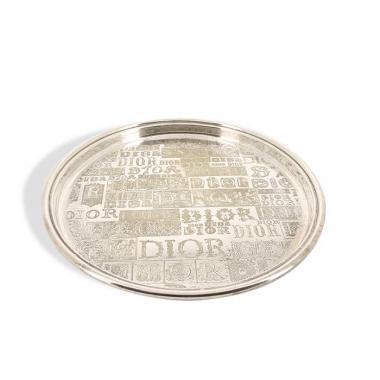Dior, plate in silvered metal and engraved, signed.