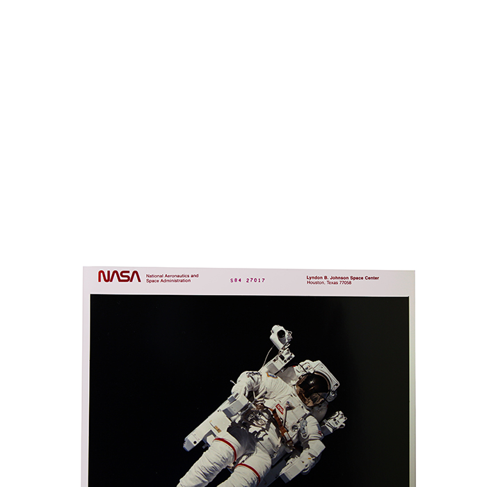 NASA, Mission STS-41B, Challenger space shuttle, photograph of the astronaut Bruce Mc Candless making the first loose flight in space, the 7th February 1984, vintage chromogenic print on Kodak paper - Detail D1