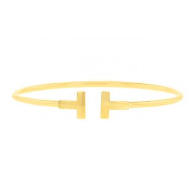Bracciale a cerchio aperto Tiffany 
Co Wire modello medio in oro giallo Bracciale a cerchio aperto Tiffany 
Co Wire modello medio in oro giallo