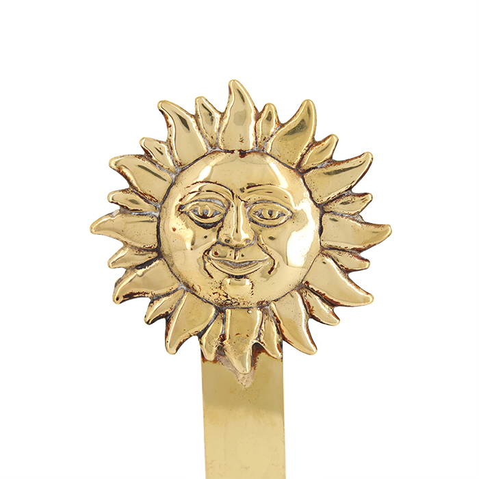 Pair of  "Sun" firedogs in golden and cast metal, from the 1980's