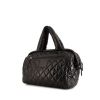 Chanel Coco Cocoon bag worn on the shoulder or carried in the hand in black quilted canvas and black leather - 00pp thumbnail