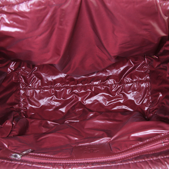 Chanel Coco Cocoon bag worn on the shoulder or carried in the hand in black quilted canvas and black leather - Detail D2