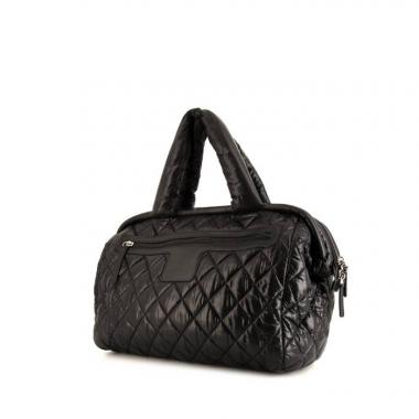 Bolso para llevar al hombro o en la mano Chanel Coco Cocoon en lona acolchada negra y cuero negro