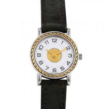 Montre Hermes Sellier - wristwatch en acier et plaqué or Vers  1987
