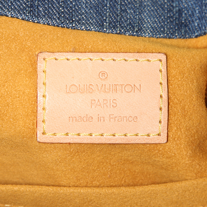 Bolso de mano Louis Vuitton Pleaty mini en lona denim Monogram azul y cuero natural - Detail D3