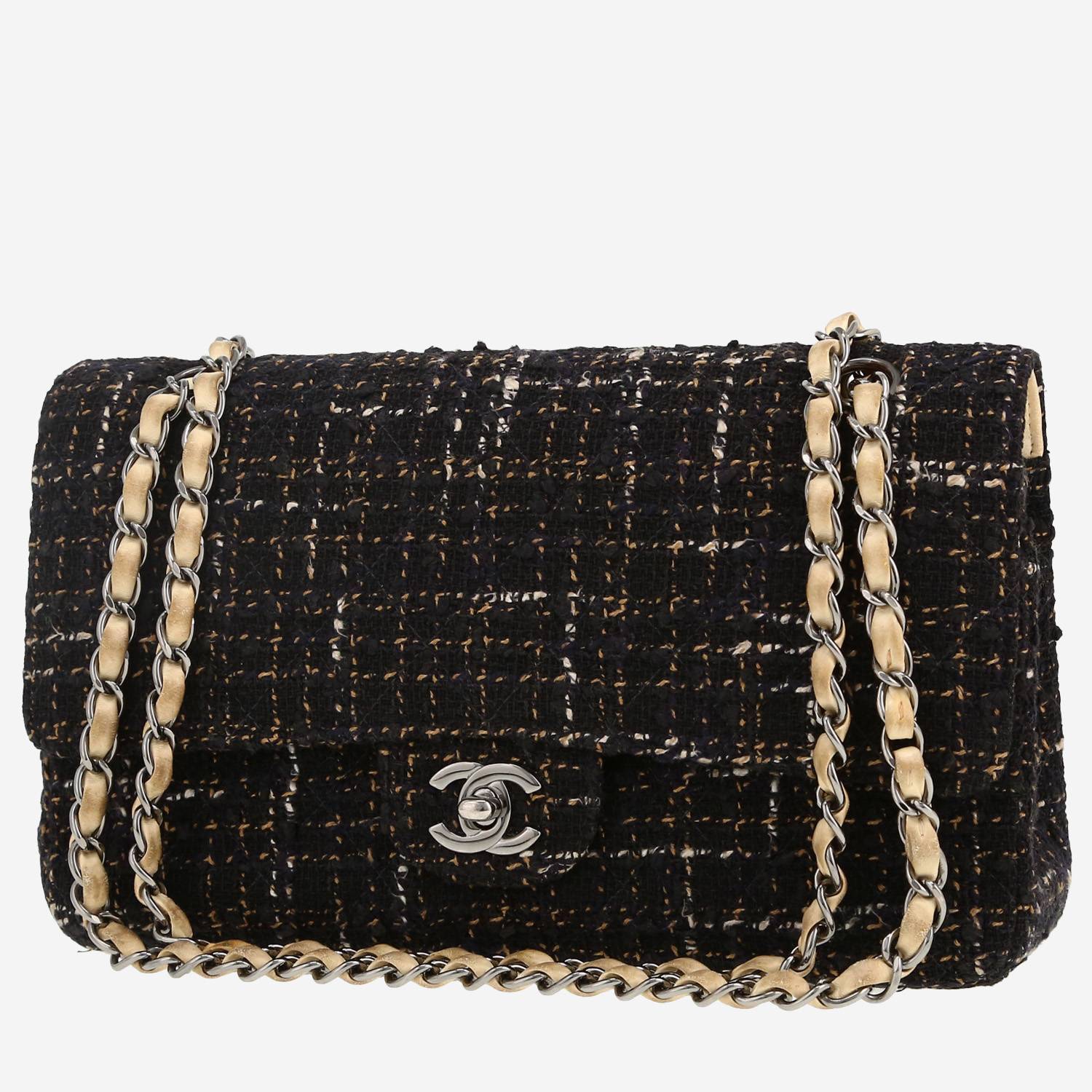 Chanel  Timeless Classic handbag  in black and cream color quilted tweed  and cream color leather