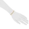 Flexible Cartier Maillon Panthère bracelet in stainless steel and yellow gold - Detail D1 thumbnail