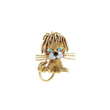 Broche Van Cleef 
Arpels Lion Ebouriffé modelo pequeño en oro amarillo,  diamantes y esmeralda