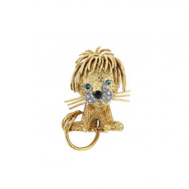Broche Van Cleef 
Arpels Lion Ebouriffé modelo pequeño en oro amarillo,  diamantes y esmeralda