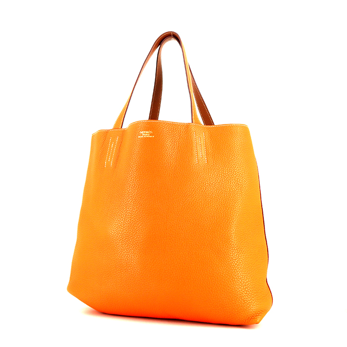 Hermes Double Sens shopping bag in gold and orange leather taurillon clémence - Detail D1
