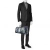 Louis Vuitton Keepall 55 cm travel bag in navy blue and white monogram canvas and navy blue leather - Detail D1 thumbnail