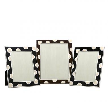 Christian Dior, a set of three rare frames, in sterling silver, enamel on creme black and brown background, from the 1980’s