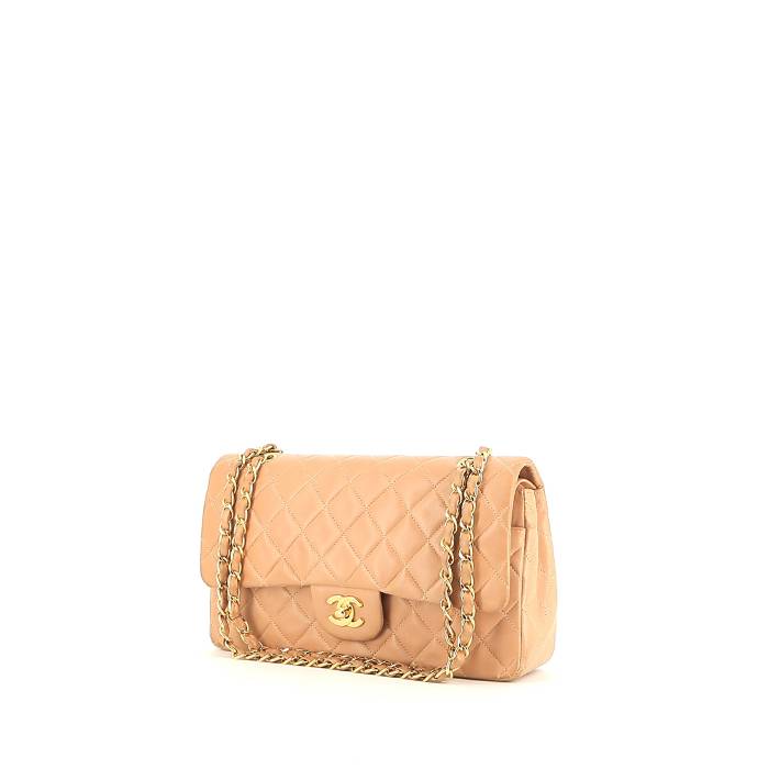 Lovely Chanel Classique Mini Pochette shoulder bag in pink quilted