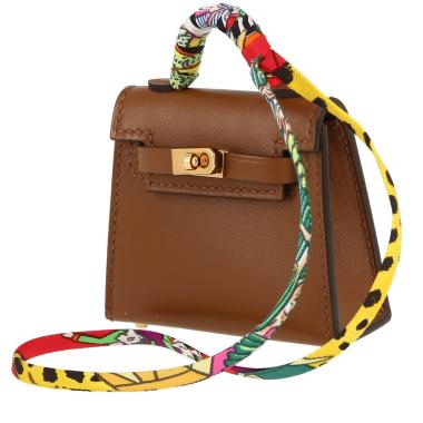 Bolso/bolsito Hermès  Kelly Twilly bag charm en cuero Tadelakt color oro y seda multicolor