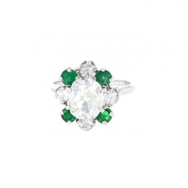 Bague Mellerio  en platine, diamants et émeraudes