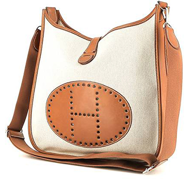 Bolso bandolera Hermès  Evelyne en lona beige y cuero Barenia color oro