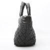 Chanel  Coco Cocoon bag worn on the shoulder or carried in the hand  in black quilted canvas  and black leather - Detail D5 thumbnail