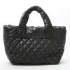 Chanel  Coco Cocoon bag worn on the shoulder or carried in the hand  in black quilted canvas  and black leather - Detail D7 thumbnail