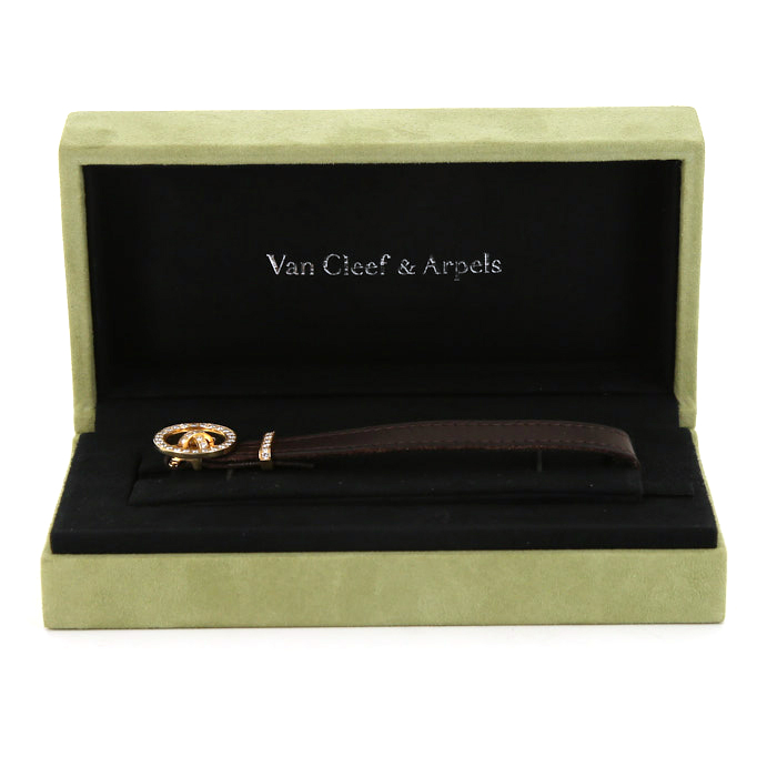 Van Cleef & Arpels Boutonnière bracelet in leather,  yellow gold and diamonds