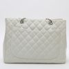 Chanel  Shopping GST large model  bag worn on the shoulder or carried in the hand  in white quilted grained leather - Detail D7 thumbnail