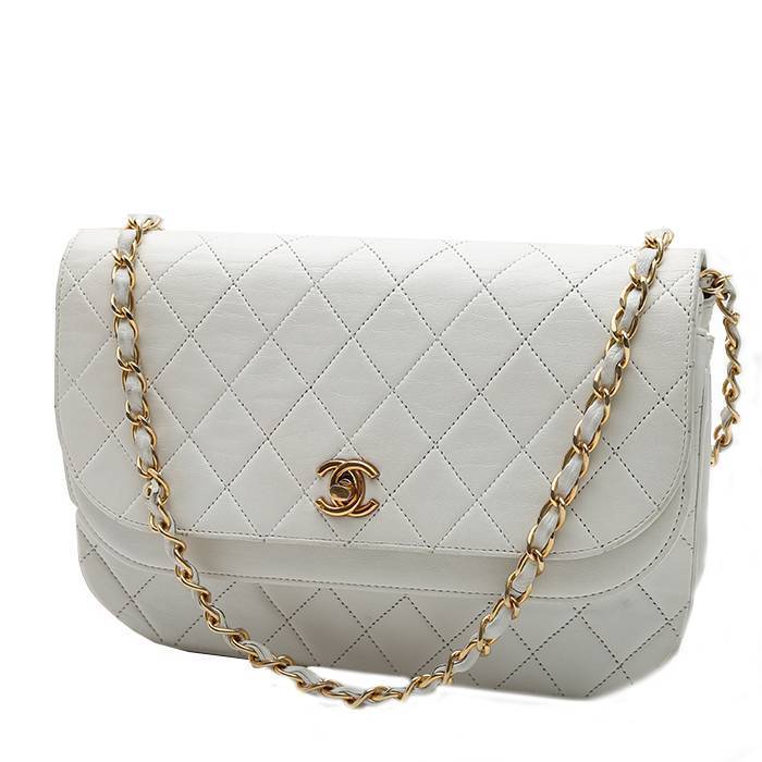 All white outfit with a cami and cardi. Chanel Diana bag. Chic