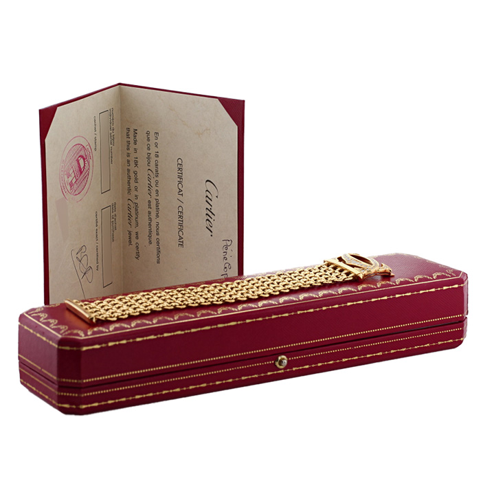 Bracelet manchette Cartier Pénélope grand modèle en or jaune et diamants Bracelet manchette Cartier Pénélope grand modèle en or jaune et diamants