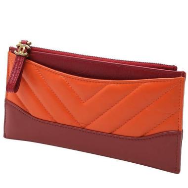 Billetera Chanel  Gabrielle  en cuero acolchado naranja y cuero color burdeos