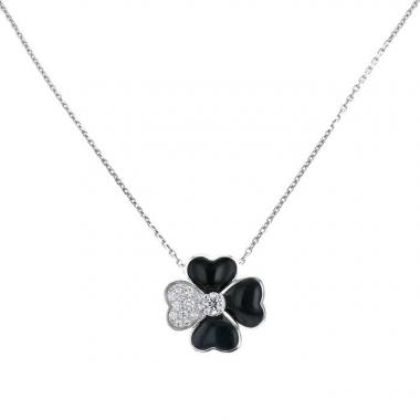 Spilla-ciondolo Van Cleef 
Arpels Cosmos in oro bianco, diamanti e onice