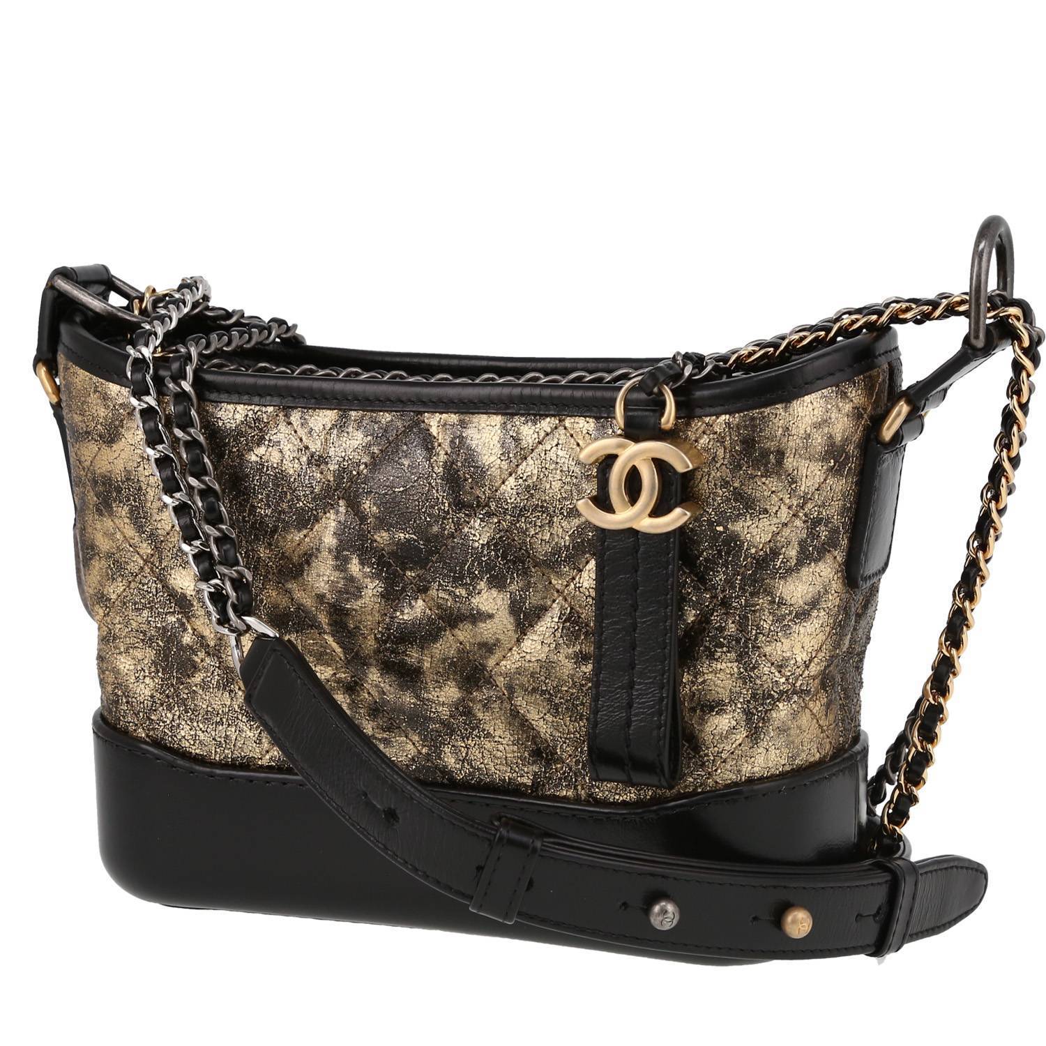 Chanel Gabrielle small model shoulder bag in gold quilted leather and black smooth leather