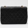 Chanel  Mademoiselle bag worn on the shoulder or carried in the hand  in black quilted leather - Detail D7 thumbnail