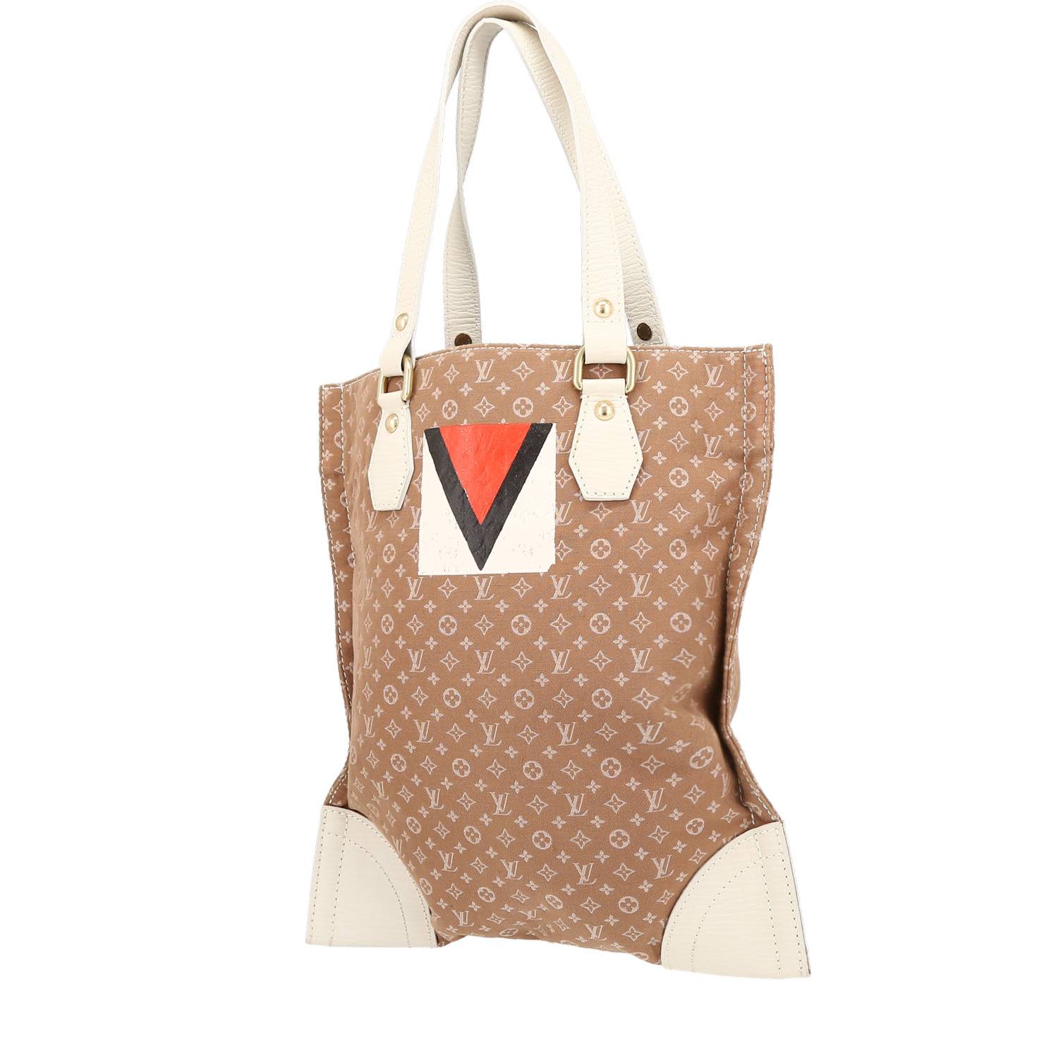 Louis Vuitton shopping bag in beige monogram canvas and white leather