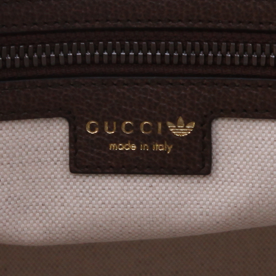 Gucci   travel bag  in beige and multicolor "sûpreme GG" canvas  and brown leather - Detail D2