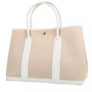 Hermès  Garden Party shopping bag  in beige canvas  and white leather