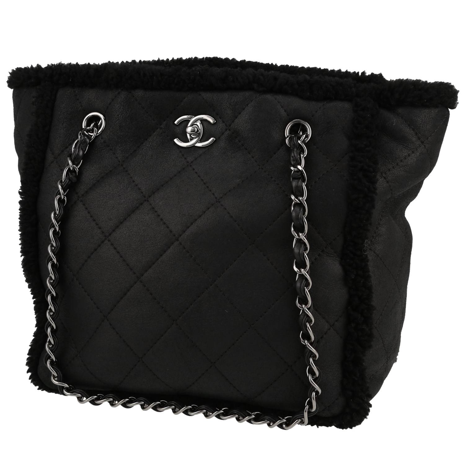 Chanel Petit Shopping handbag in black sheepskin and black leather