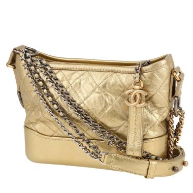Bolso bandolera Chanel  Gabrielle  modelo pequeño  en cuero acolchado dorado