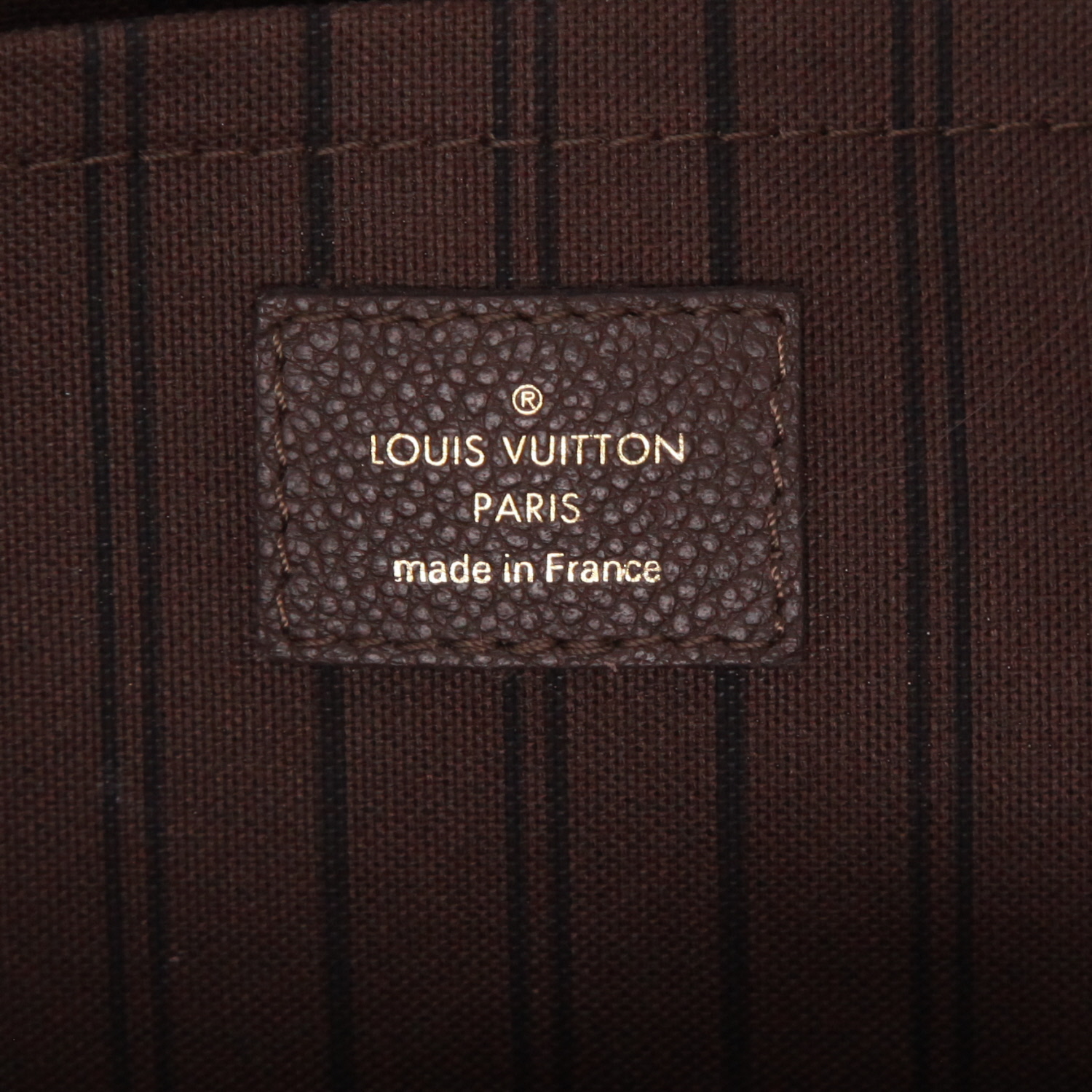 Louis Vuitton  Montaigne handbag  in brown empreinte monogram leather - Detail D2