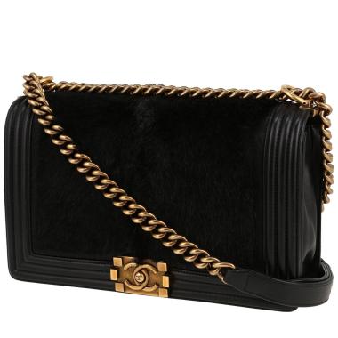 Chanel  Boy shoulder bag  in black leather  and black synthetic furr