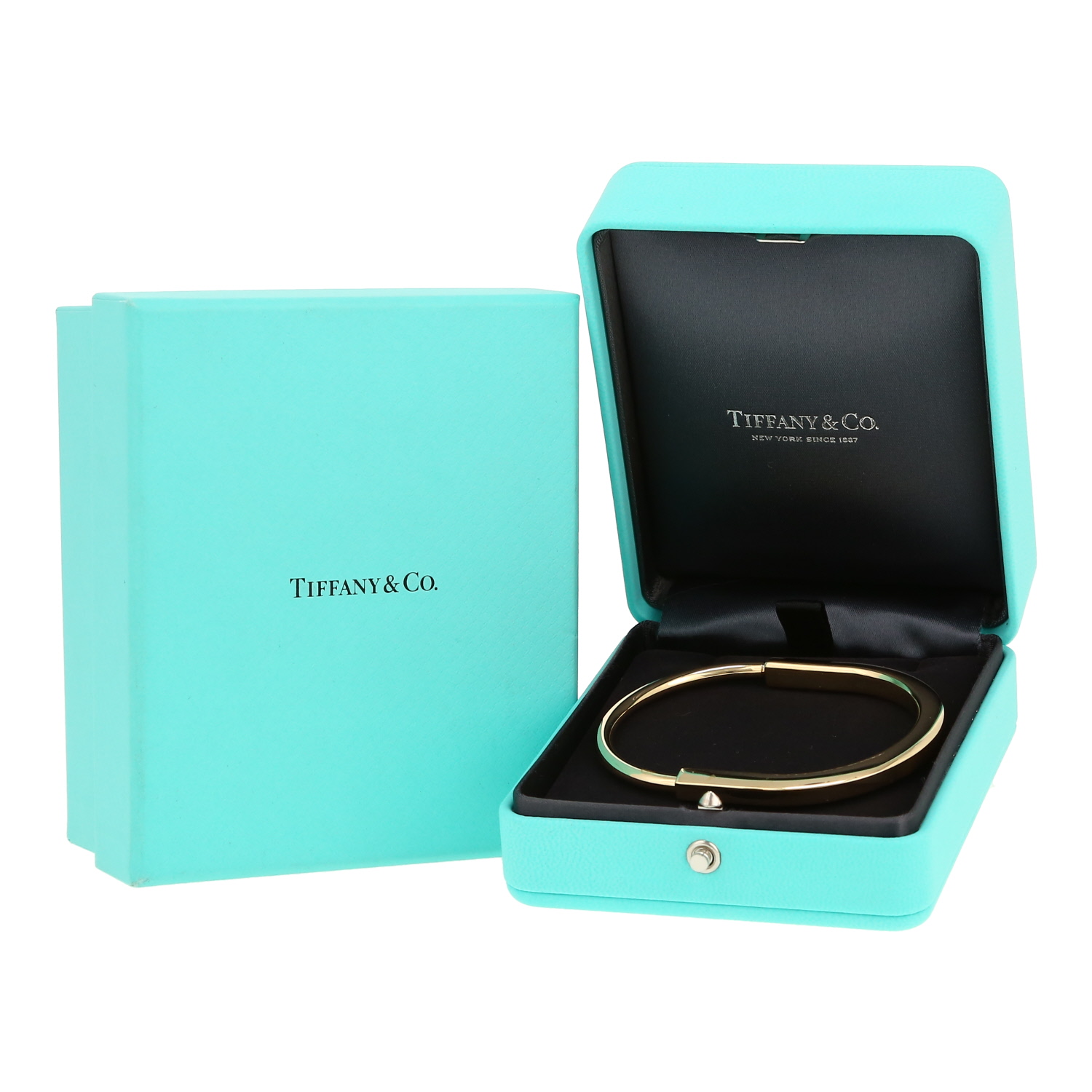 Opening Tiffany 
Co Lock bracelet in yellow gold