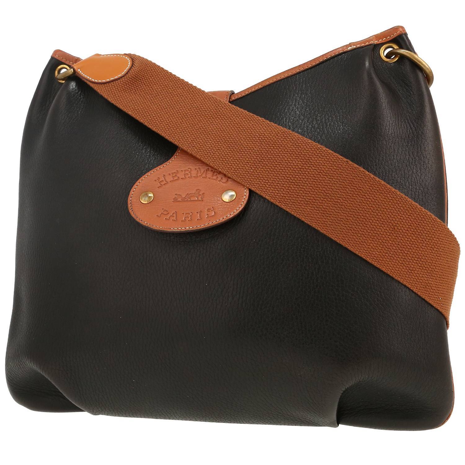 Bolso de mano Hermès   en cuero bicolor negro y color oro - 00pp