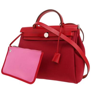 Bolso para llevar al hombro o en la mano Hermès  Herbag en lona roja y rosa y cuero rojo