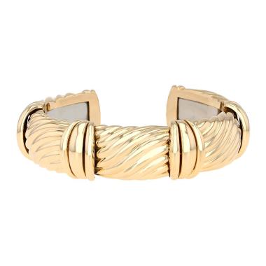 Brazalete semirrígido O.J. Perrin  de oro amarillo y acero