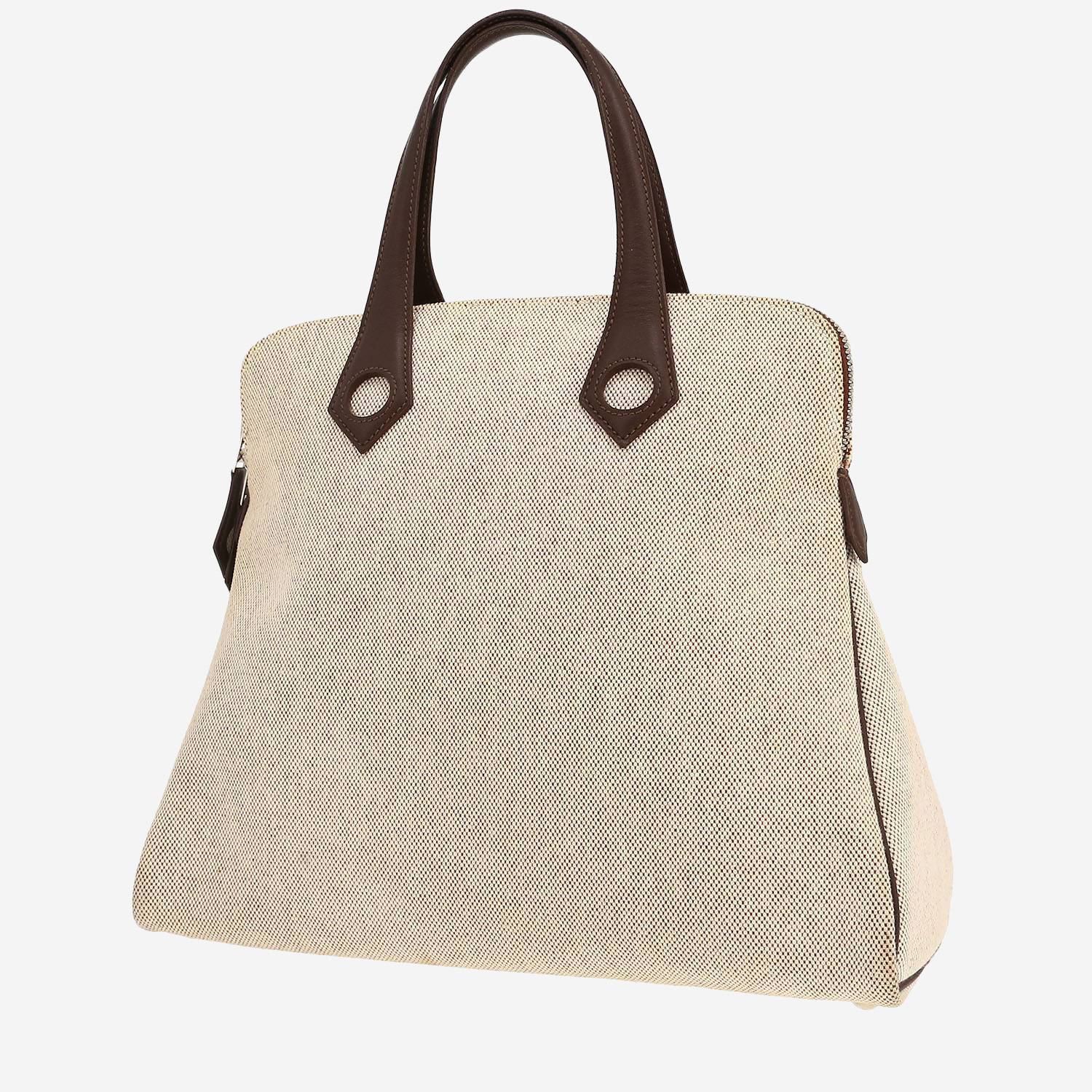 Hermès  Heeboo handbag  in beige canvas  and brown leather