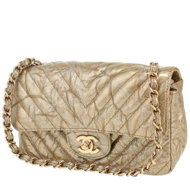 Bolso bandolera Chanel  Mini Timeless en charol acolchado dorado