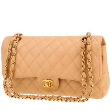 Sac à main Chanel  Timeless moyen modèle  en cuir grainé matelassé beige
