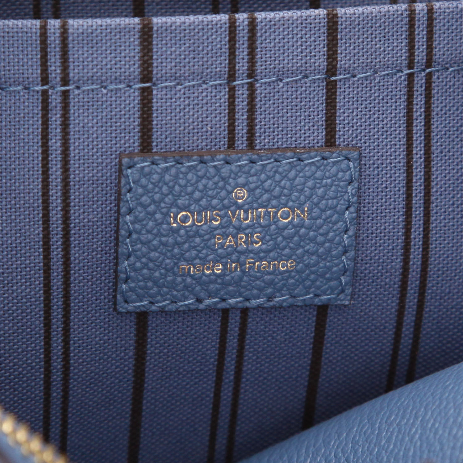 Louis Vuitton Montaigne handbag in blue empreinte monogram leather - Detail D2